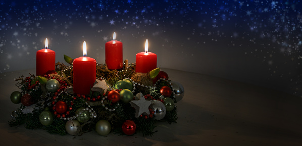Red candles and baubles on white background. This File is cleaned, retouched and contains 