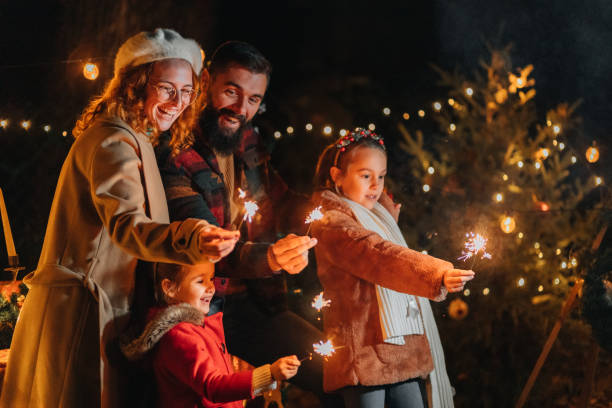 istock Family having fun with Christmas sparklers 1444838132