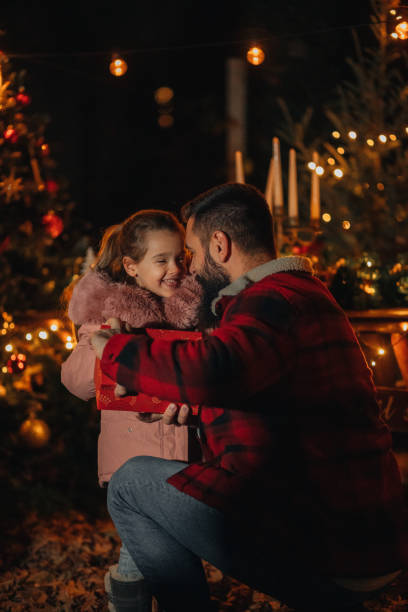 istock Young dad giving Christmas present to his daughter 1444840917