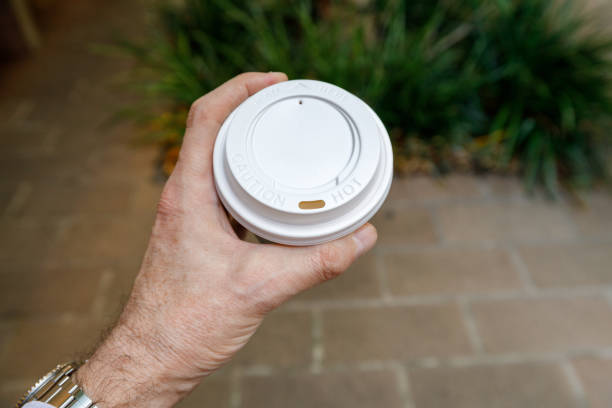 istock A man's hand holding a takeaway coffee 1444846719