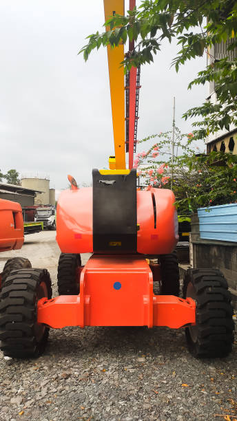 istock Orange boom Lift 24 meters articulate front view. 1444847379