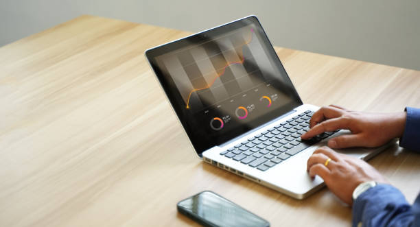 istock business man talking at computer Find a solution to your company's recession or inflation business idea. 1444848672