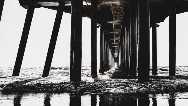 istock Abstract geometry of Huntington Beach Pier at low tide 1444857785
