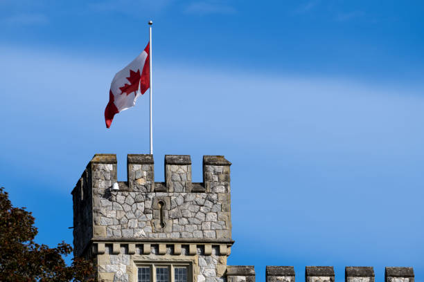 Canadian flag at Hatley Castle, Victoria, BC Canada Victoria, BC Canada - September 24, 2022: Canadian flag flying at Hatley Castle, Victoria, BC Canada colwood photos stock pictures, royalty-free photos & images