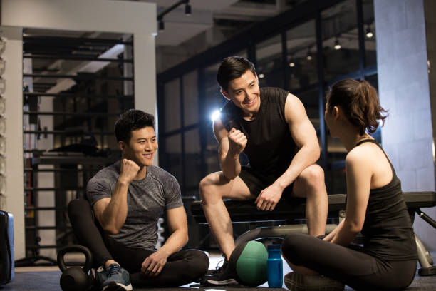 istock Three young people relaxing and chatting together in the gym 1444868191