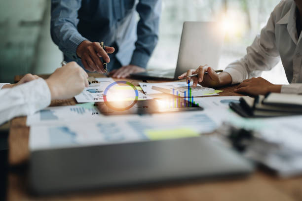 istock Business team colleagues discussing working analysis with financial data and marketing growth report graph in team, Meeting Talking Brainstorming Communication Concept 1444870115