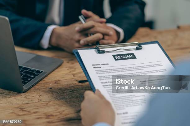 Hiring Concept Hr Manager Is Interviewing A Job Candidate Filling Out A Resume On A Job Application Form To Be Considered For A Job Stock Photo - Download Image Now