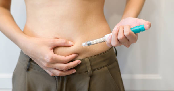 istock Close up woman using IVF treatment injection on belly 1444882570