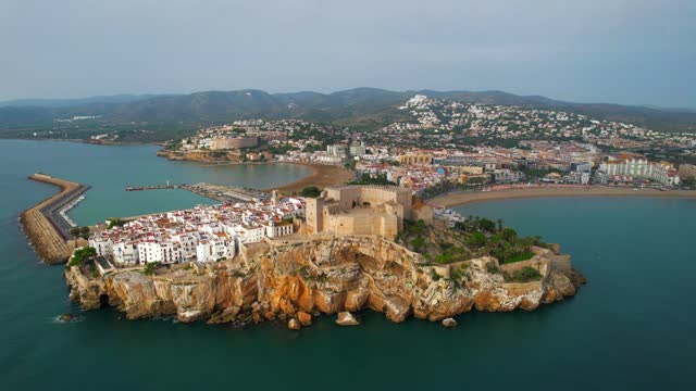 Aerial fly over above one of the most beautiful seaside mediterranean villages in Sapin, Peniscola