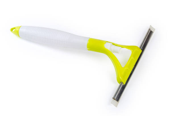 istock Scraper with spray bottle for cleaning windows and glass surfaces 1444894786