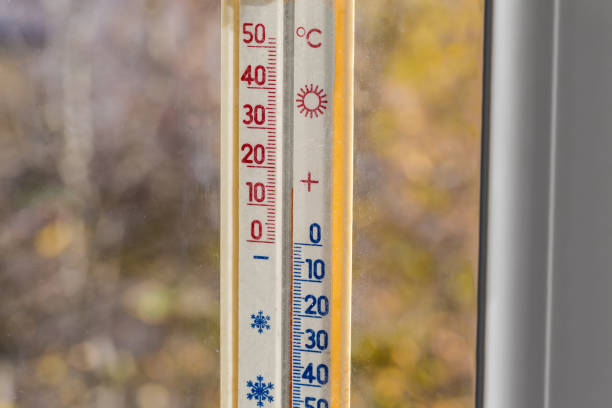 istock Outdoor thermometer with Celsius scale attached to window, inside view 1444894980