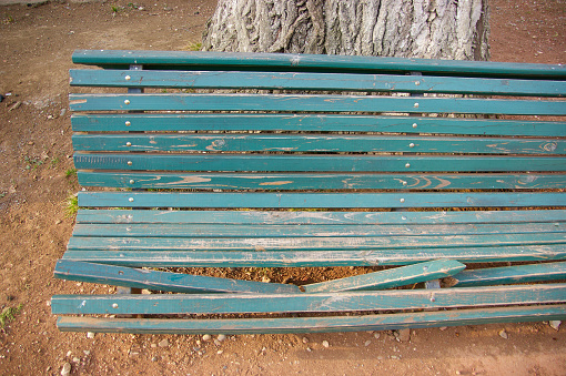 broken park bench. vandals broke a park bench