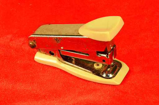 The stapler began to rust on the red cloth