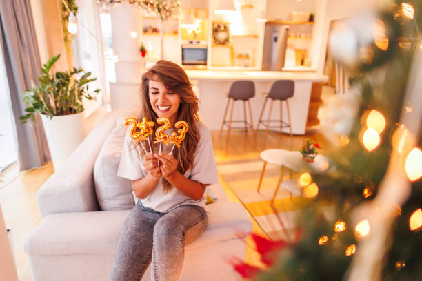 istock Woman decorating home for New Year celebration 1444903819
