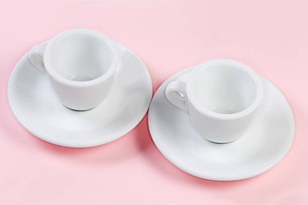 istock Small empty white coffee cups with handles on the saucer 1444903839