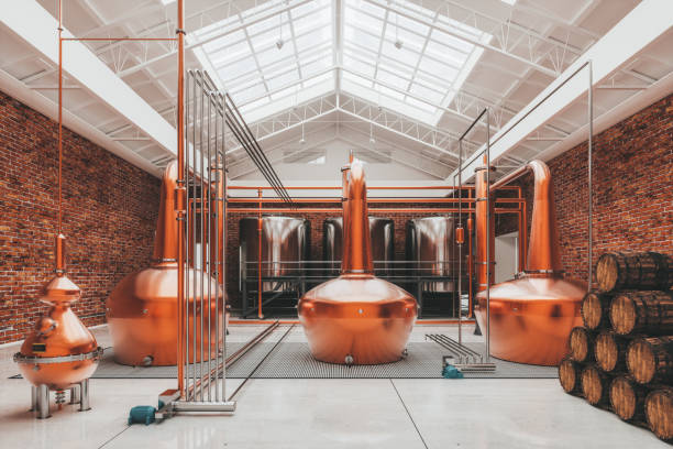 Copper Whiskey Vats In Distillery stock photo