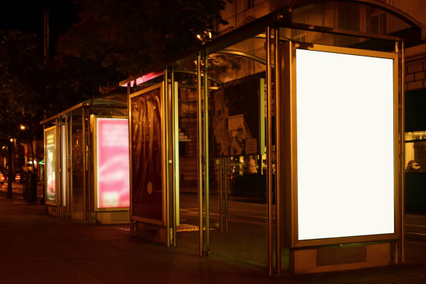 istock night image of bus stop with illuminated poster ad and billboard lightbox. mock-up base. 1444905929