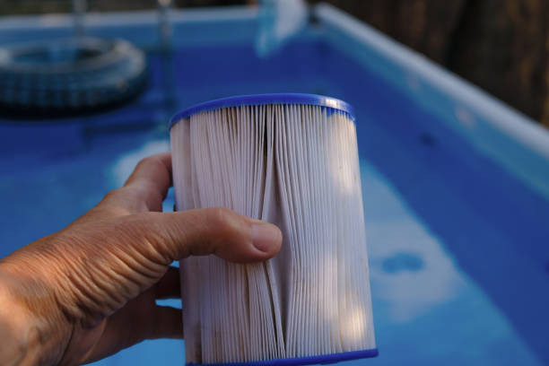 istock Replacement Pool Filter Cartridge in a woman's hand. Filter reuse. 1444905970