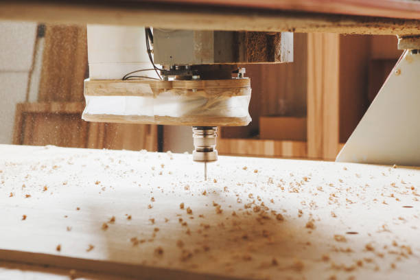 istock Cnc machine working, cutting wood. Woodwork industry. 1444907539