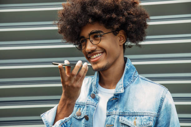 istock African american man with african hairstyle using phone 1444910583