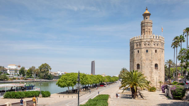 torre del oro, the golden tower located on the left bank of guadalquivir river in seville, andalusia, spain - seville sevilla torre del oro tower imagens e fotografias de stock