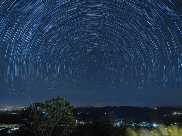 istock Stars Spinning in Night Sky 1444915675