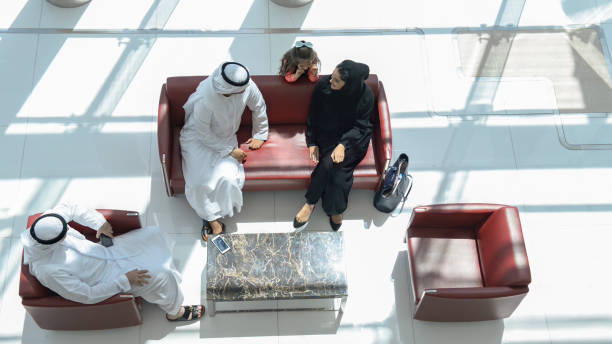 istock Multi-generation Emirati family resting in a shopping mall 1444917100