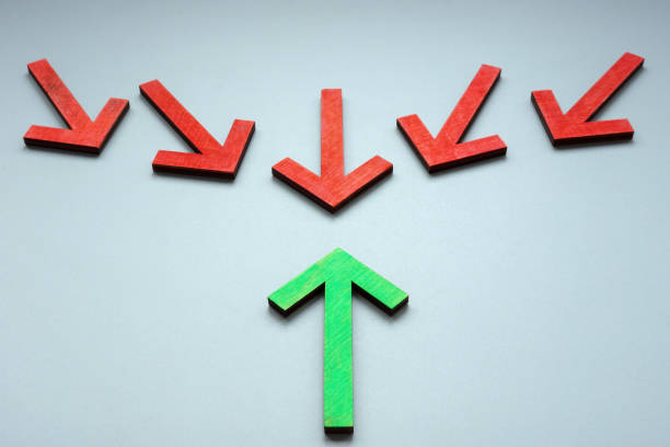 istock Green arrow towards red. Resilience and leadership. 1444917408