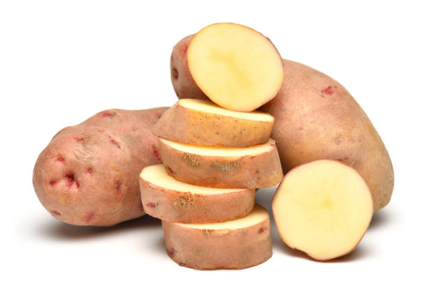 istock potatoes close up, whole and sliced, objects are isolated on a white background 1444917613