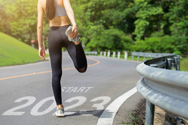 Starting to the new year 2023. Woman a runner waiting to start the new year 2023.Planning, opportunity, challenge, and business strategy. Goals, plans, and Adopt for Success in 2023 for new life. Starting to the new year 2023. Woman a runner waiting to start the new year 2023.Planning, opportunity, challenge, and business strategy. Goals, plans, and Adopt for Success in 2023 for new life. Running stock pictures, royalty-free photos & images