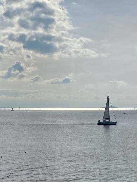istock Sea side, sailboat, sky, sea, dramatic 1444920137