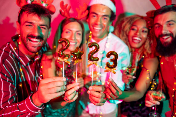 istock Friends having fun singing and dancing at New Year party 1444920773