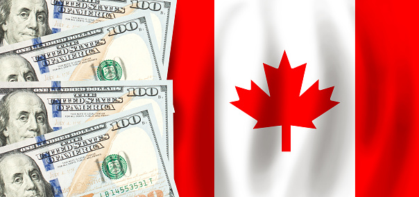 Dollars on flag of Canada, Canadian finance, subsidies, social support, GDP concept