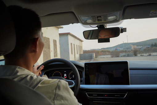 man concentrating on driving