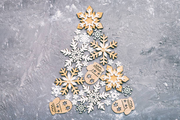istock Christmas tree made from colored handmade ball decoration on colored background, view from above. New Year minimal concept with copy space 1444922599