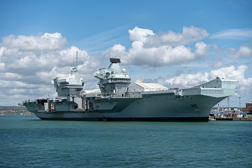 The British Naval fleet flagship HMS Queen Elizabeth docked in Portsmouth naval base.