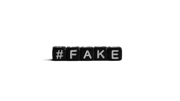 istock Word fake with hashtag, black letter beads on white background 1444925144