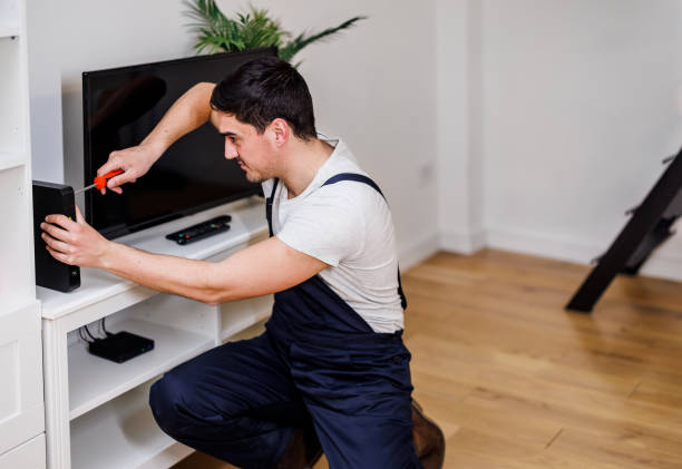 istock A young man is fixing a router with a screwdriver. 1444926354