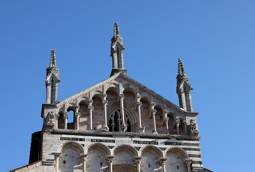 Massa Marittima, Italy - Sept 11, 2022: View at the Cathedral of Saint Cerbonius with Bell tower at the Garibaldi place in Massa Marittima. Italy