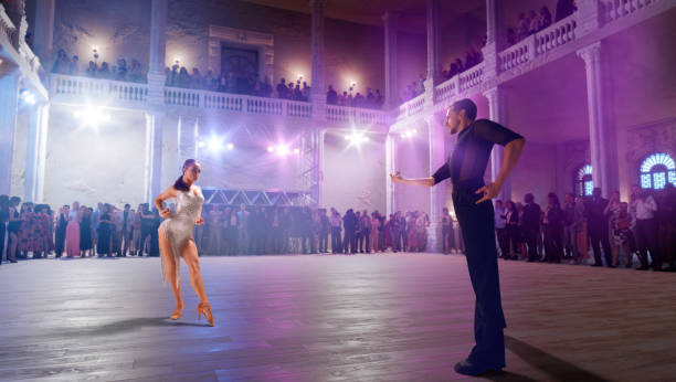 istock Couple dancers  perform latin dance on large professional stage. 1444928065