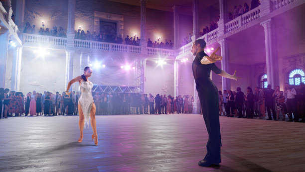 istock Couple dancers  perform latin dance on large professional stage. 1444928082