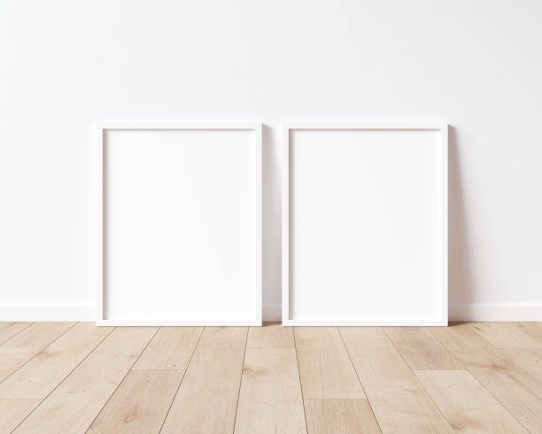 istock Two vertical wood frame mock up. Two mock up poster on wooden floor 3D illustrations. 1444929149