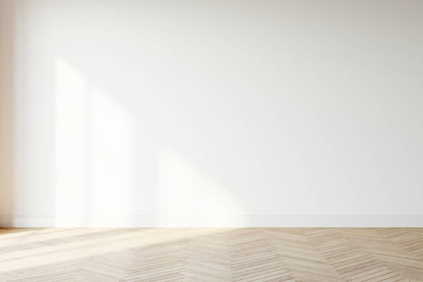 istock Empty wall mockup. Empty room with a white wall and wood floor. 3D illustration. 1444929256