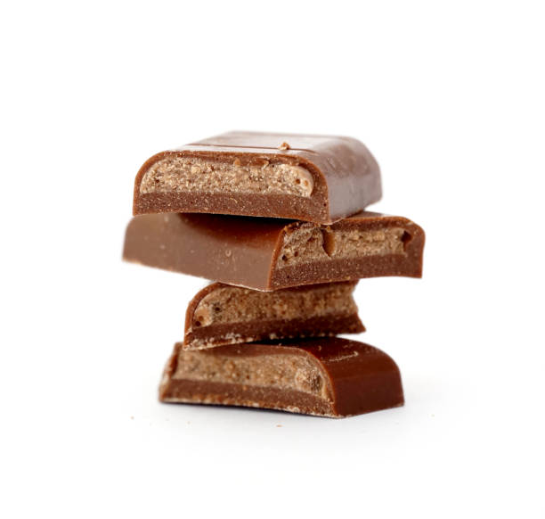 istock Filled Chocolate bar. Broken pieces over white background 1444929388