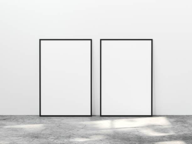 istock Two vertical black frame mock up on concrete floor with light overlays. Set of two black frame mock up poster. Two vertical frame 3d illustration. 1444929610
