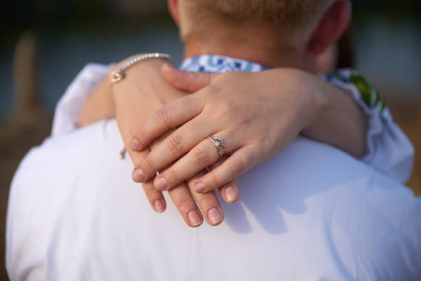 istock Wedding rings on hands close-up 1444931882