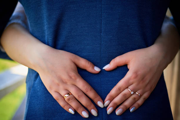 istock Wedding rings on hands close-up 1444931902