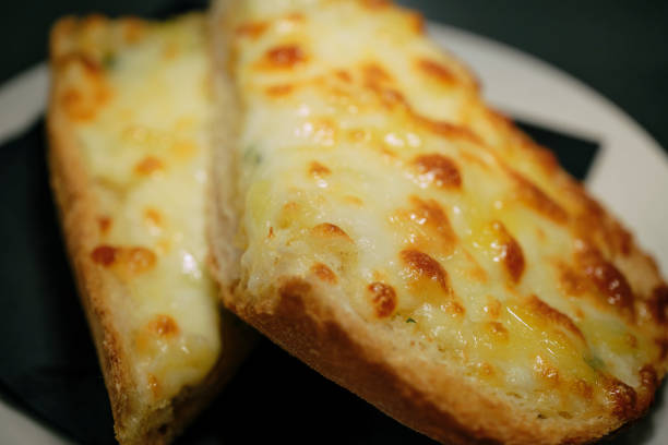Close up of Garlic Bread with melted cheese.