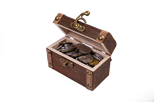 Treasure chest overflowing with money.