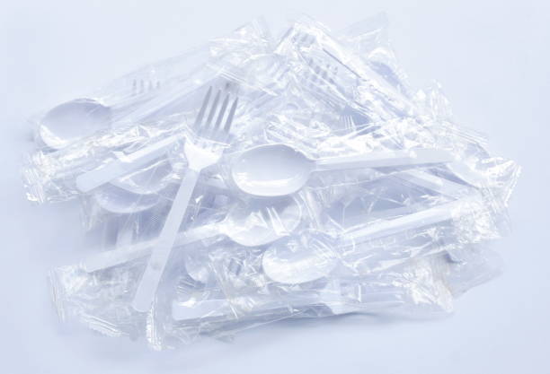 istock plastic spoon and fork for single used in transparent packaging  arranging on white background 1444938638